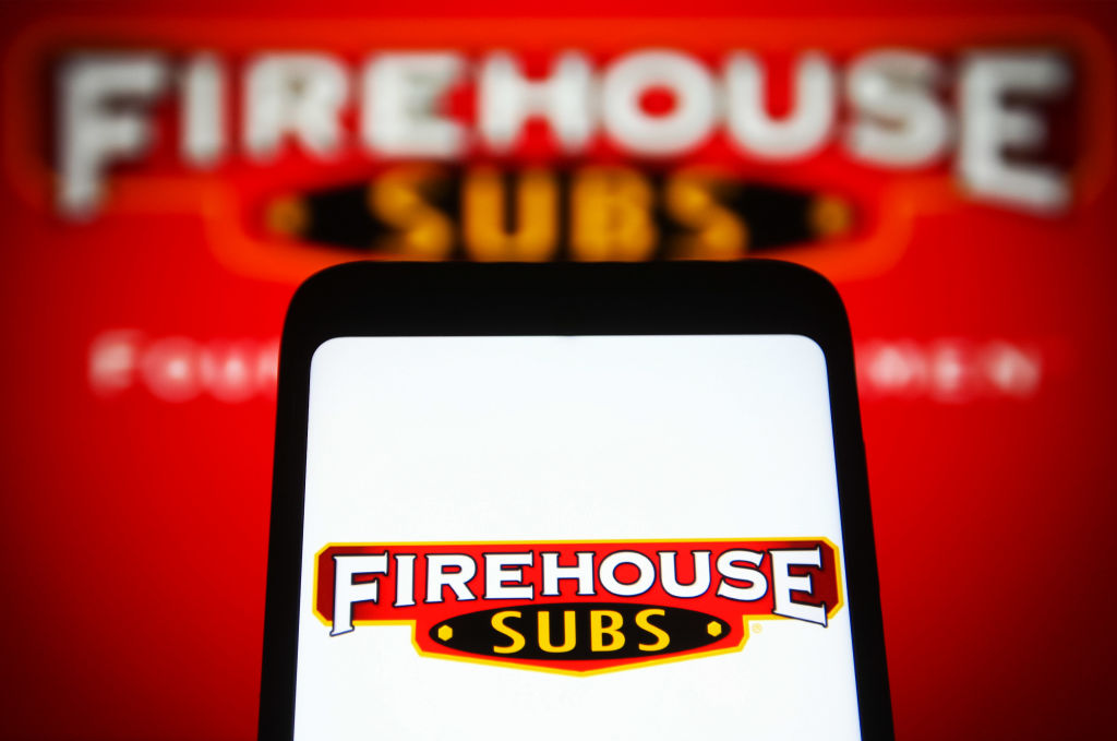 In this photo illustration, a Firehouse Subs (Firehouse...